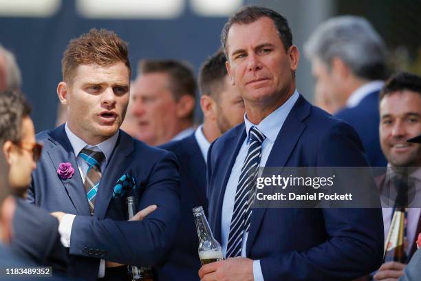 Player Heath Shaw of the GWS Giants and former AFL great Wayne Carey are seen during Cox Plate Day at Mooney Valley Racecourse on October 26, 2019 in...