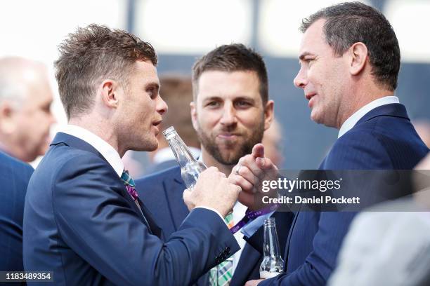 Player Heath Shaw of the GWS Giants and former AFL great Wayne Carey are seen during Cox Plate Day at Mooney Valley Racecourse on October 26, 2019 in...