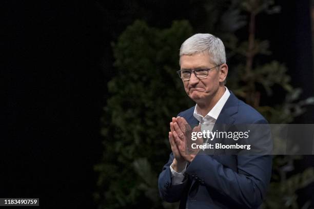 Tim Cook, chief executive officer of Apple Inc., gestures to attendees at the conclusion of a keynote at the 2019 DreamForce conference in San...