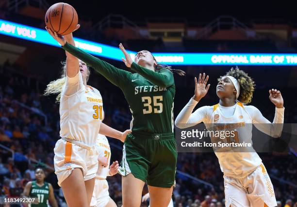 Tennessee Lady Vols center Emily Saunders blocks the shot of Stetson Hatters forward Kendall Lentz during a college basketball game between the...