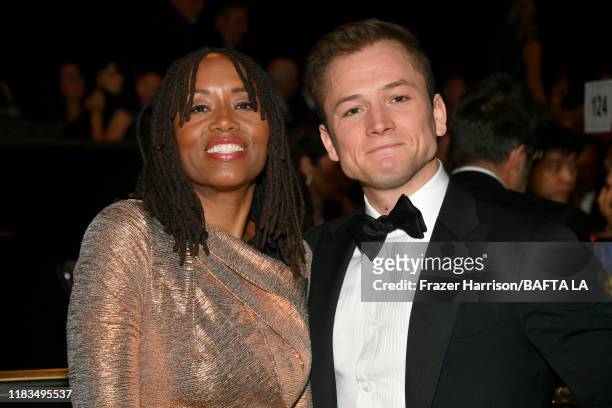 Los Angeles Chair of the Board Kathryn Busby and Taron Egerton pose during the 2019 British Academy Britannia Awards presented by American Airlines...
