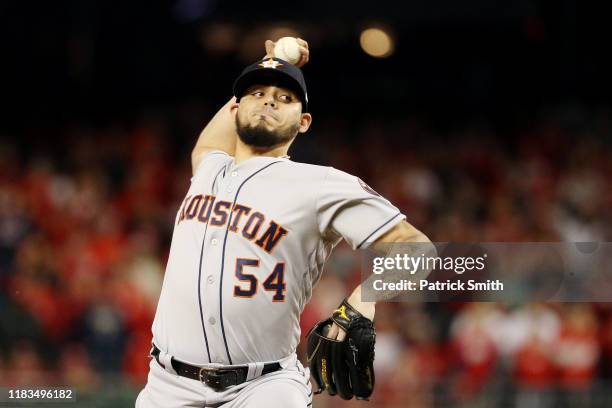 Roberto Osuna of the Houston Astros delivers the pitch against the Washington Nationals during the ninth inning in Game Three of the 2019 World...