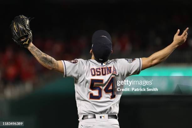 Roberto Osuna of the Houston Astros celebrates his teams 4-1 win over the Washington Nationals in Game Three of the 2019 World Series at Nationals...