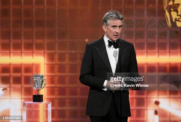 Steve Coogan accepts the Charlie Chaplin Britannia Award for Excellence in Comedy Presented by Jaguar Land Rover onstage during the 2019 British...