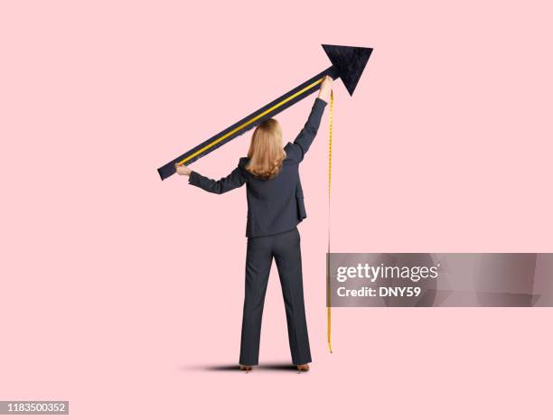 businesswoman measuring progress - measuring potential business stock pictures, royalty-free photos & images