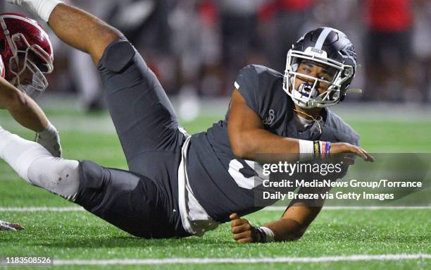 St. John Bosco quarterback DJ Uiagalelei hits the turf after a sack in Bellflower on Friday, Oct. 25, 2019.