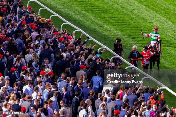 Damian Lane salutes the crowd on Lys Gracieux after winning race 9 the Ladbrokes Cox Plate during Cox Plate Day at Moonee Valley Racecourse on...