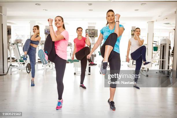 women exercise at gym - aerobic stock pictures, royalty-free photos & images