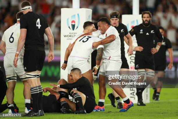 Manu Tuilagi of England celebrates with Mako Vunipola after scoring a try during the Rugby World Cup 2019 Semi-Final match between England and New...