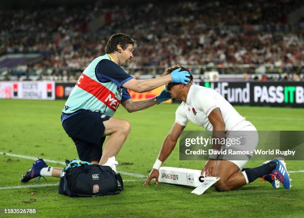 Anthony Watson of England receives medical attention during the Rugby World Cup 2019 Semi-Final match between England and New Zealand at...
