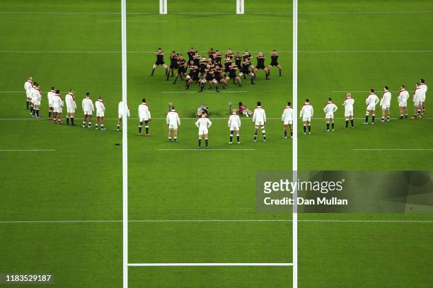 England players look on while New Zealand players perform a haka during the Rugby World Cup 2019 Semi-Final match between England and New Zealand at...