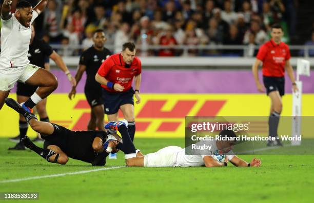 Ben Youngs of England scores a try as he beats the tackle of Aaron Smith of New Zealand before it being disallowed during the Rugby World Cup 2019...