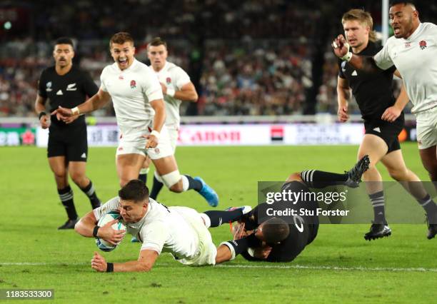 Ben Youngs of England scores a try as he beats the tackle of Aaron Smith of New Zealand before it being disallowed during the Rugby World Cup 2019...