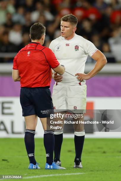Referee Nigel Owens talks to Owen Farrell of England during the Rugby World Cup 2019 Semi-Final match between England and New Zealand at...