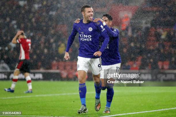 Jamie Vardy of Leicester City celebrates after scoring his team's fifth goal with Ayoze Perez of Leicester City during the Premier League match...