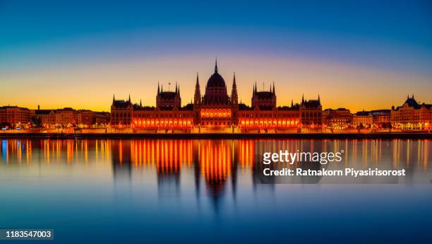 sunrise scene of budapest parliament with dramatic sunrise, budapest, hungary - hungary landscape stock pictures, royalty-free photos & images