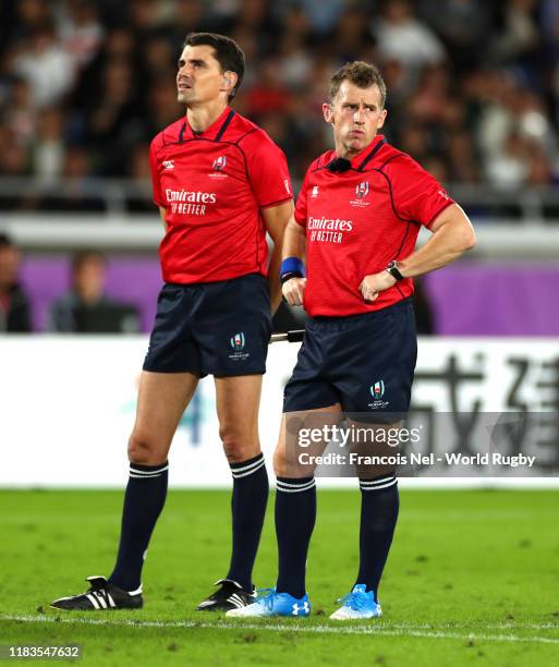 Match Referee Nigel Owens and Assistant Referee Pascal Gauzere look on during the Rugby World Cup 2019 Semi-Final match between England and New...