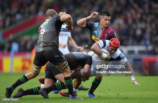 Siale Piutau of Bristol Bears is tackled by Will Evans of Harlequins during the Gallagher Premiership Rugby match between Harlequins and Bristol...