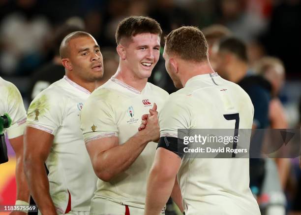 Tom Curry of England celebrates with team mate Sam Underhill after their victory during the Rugby World Cup 2019 Semi-Final match between England and...