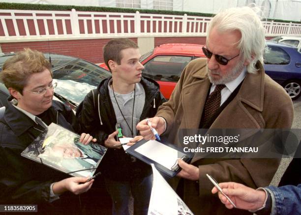 Actor Donald Sutherland signs autographs 02 September 2000 in the northwestern French cty of Deauville, where he came to present "Space Cowboys,"...