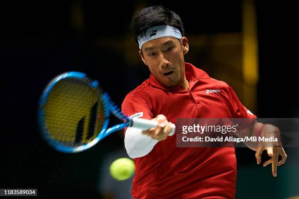 Yuichi Sugita of Japan in action during his match against Filip Krajinovic of Serbia during Day Three of the 2019 Davis Cup at La Caja Magica on...