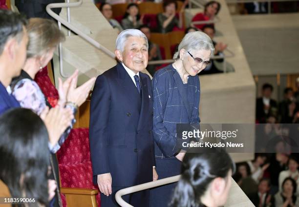Former Japanese Emperor Akihito and Empress Michiko arrive at Suntory Hall in Tokyo on Nov. 20 to attend a Berlin Philharmonic concert.