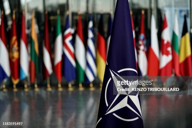 Picture taken on November 20, 2019 shows a NATO flag at the NATO headquarters in Brussels, during a NATO Foreign Affairs ministers' summit. - NATO...