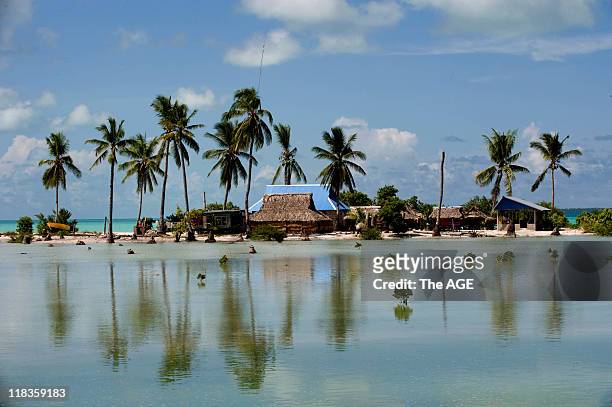 Kiribati Islands, Climate Change. Flooded homes in the village of Taborio on the island of Tarawa.