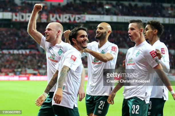 Davy Klaassen of SV Werder Bremen celebrates with teammates after scoring his team's second goal during the Bundesliga match between Bayer 04...