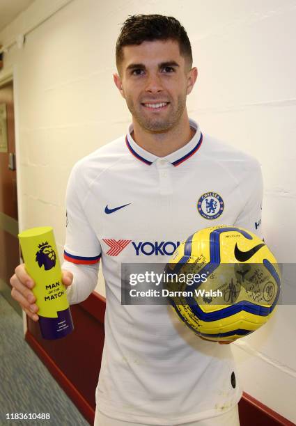 Christian Pulisic of Chelsea collects the match ball and the Man of the Match award following his hatrick during the Premier League match between...