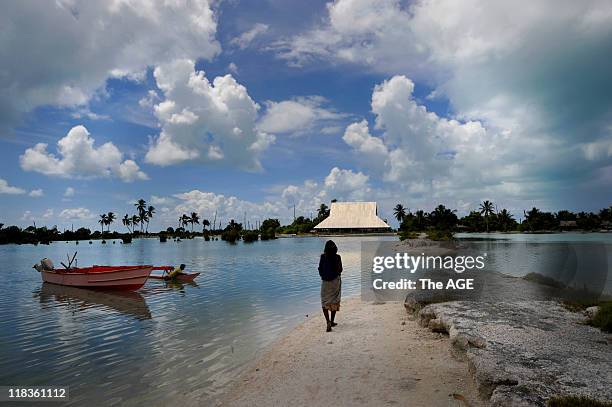 Kiribati Islands, Climate Change. The village of Tebunginako on the island of Abaiang had to be relocated because of rising seas and erosion. This...