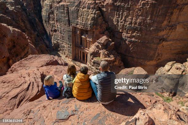 visiting the ancient city of petra with kids,  the treasury (al khazneh) seen from above, petra, jordan - the siq stockfoto's en -beelden