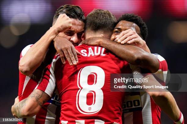 Saul Niguez of Club Atletico de Madrid celebrates after scoring his team's first goal battle for the ball with Athletic Club during the Liga match...