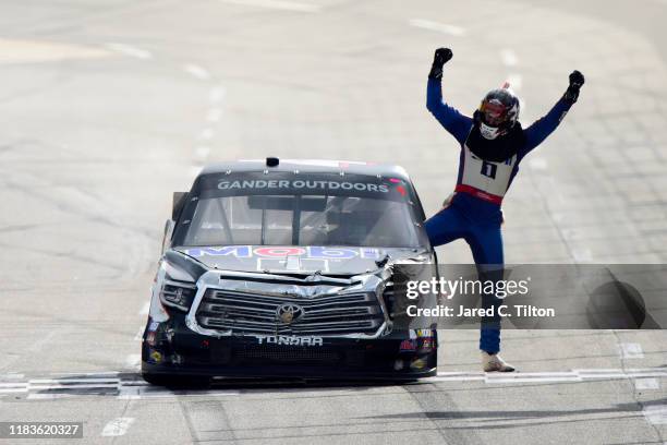 Todd Gilliland, driver of the Mobil 1 Toyota, celebrates winning the NASCAR Gander Outdoor Truck Series NASCAR Hall of Fame 200 at Martinsville...