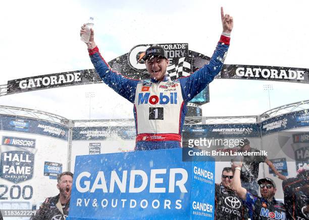 Todd Gilliland, driver of the Mobil 1 Toyota, celebrates in Victory Lane after winning the NASCAR Gander Outdoor Truck Series NASCAR Hall of Fame 200...