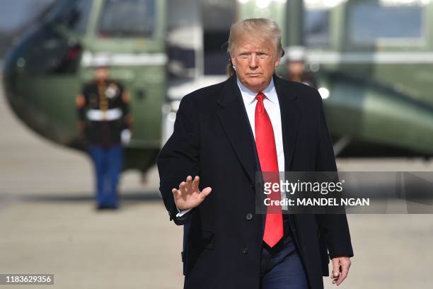 President Donald Trump makes his way to board Air Force One before departing from Andrews Air Force Base in Maryland on November 20, 2019. -...
