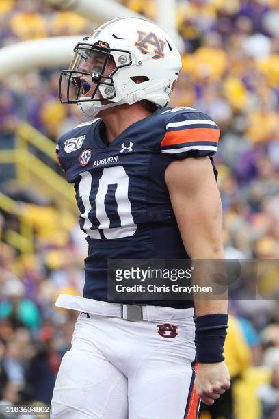 Bo Nix of the Auburn Tigers celebrates after a touchdown against the LSU Tigers during the first half at Tiger Stadium on October 26, 2019 in Baton...