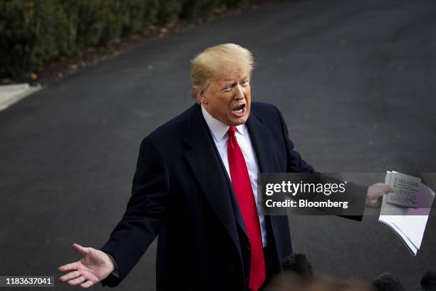 President Donald Trump speaks to members of the media before boarding Marine One on the South Lawn of the White House in Washington, D.C., U.S., on...