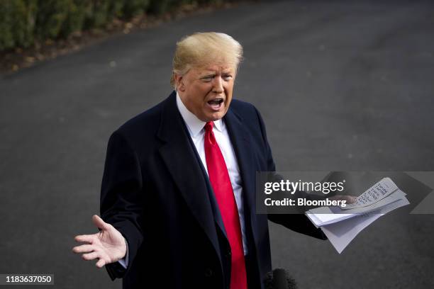 President Donald Trump speaks to members of the media before boarding Marine One on the South Lawn of the White House in Washington, D.C., U.S., on...