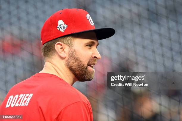 Brian Dozier of the Washington Nationals looks on during batting practice prior to Game Four of the 2019 World Series against the Houston Astros at...