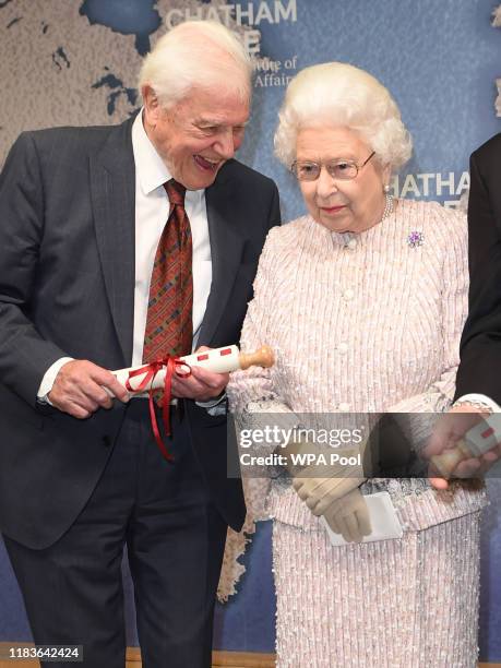 Queen Elizabeth II presents the Chatham House Prize 2019 to Sir David Attenborough and Julian Hector, Head of the BBC Natural History Unit at the...