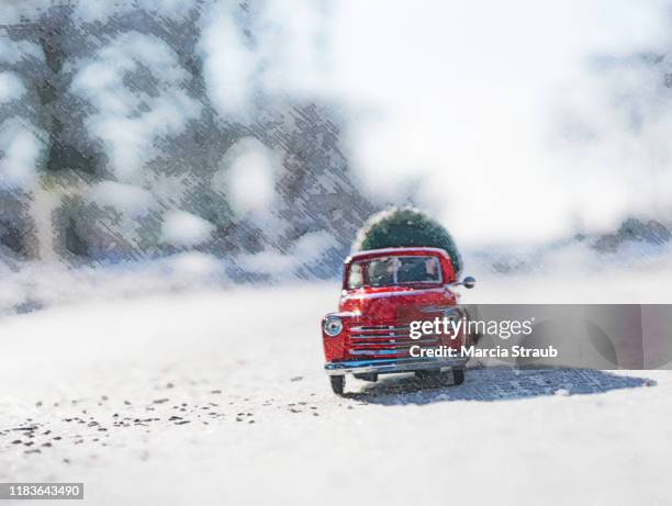 vintage red pick up truck on a snowy road loaded with a christmas tree - christmas truck bildbanksfoton och bilder