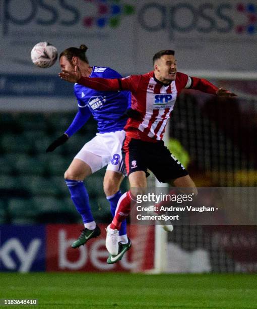 Lincoln City's Jason Shackell battles with Ipswich Town's Will Keane during the FA Cup First Round Replay match between Lincoln City and Ipswich Town...