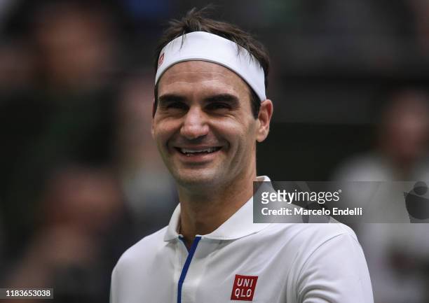 Roger Federer of Switzerland smiles during an exhibition game between Alexander Zverev and Roger Federer at Arena Parque Roca on November 20, 2019 in...