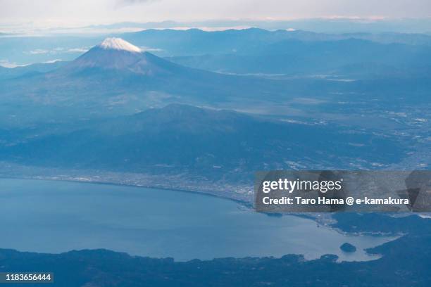 snow-capped mt. fuji and suruga bay in japan aerial view from airplane - mishima city stock pictures, royalty-free photos & images