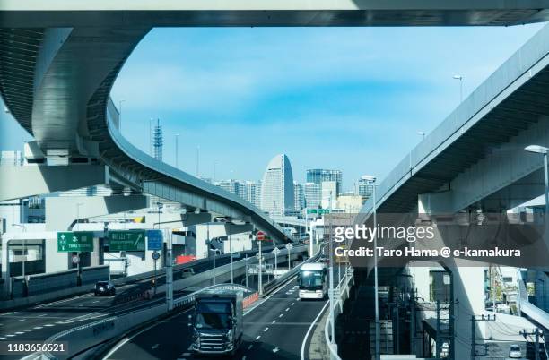 urban highway and city buildings in yokohama city of japan - japanese exit sign stock pictures, royalty-free photos & images