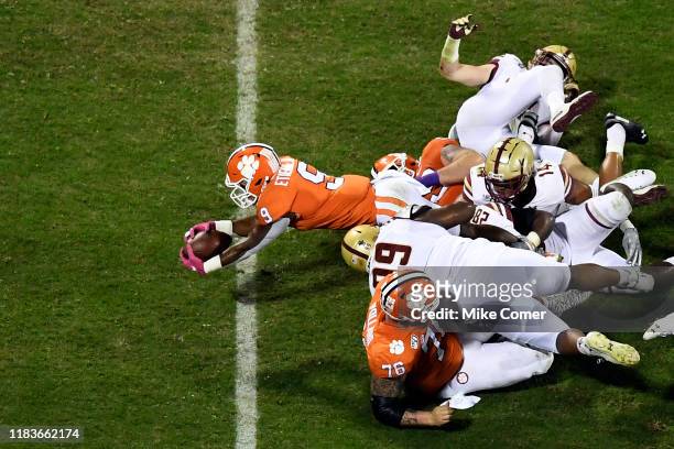 Running back Travis Etienne of the Clemson Tigers dives for a touchdown against the Boston College Eagles during the first quarter of their football...