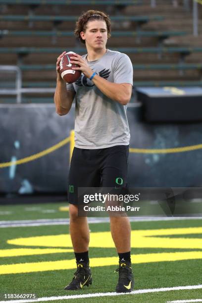 Justin Herbert of the Oregon Ducks warms up prior to taking on the Washington State Cougars during their game at Autzen Stadium on October 26, 2019...