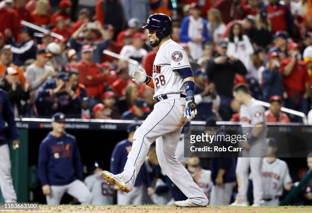 Robinson Chirinos of the Houston Astros celebrates his two-run home run against the Washington Nationals during the fourth inning in Game Four of the...