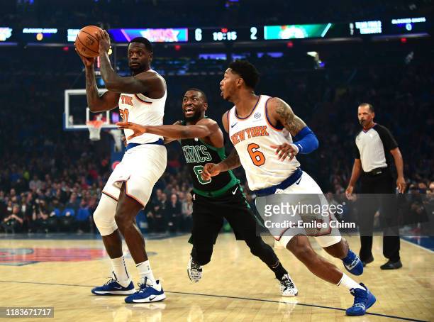 Kemba Walker of the Boston Celtics guards Julius Randle of the New York Knicks during the first half of their game at Madison Square Garden on...
